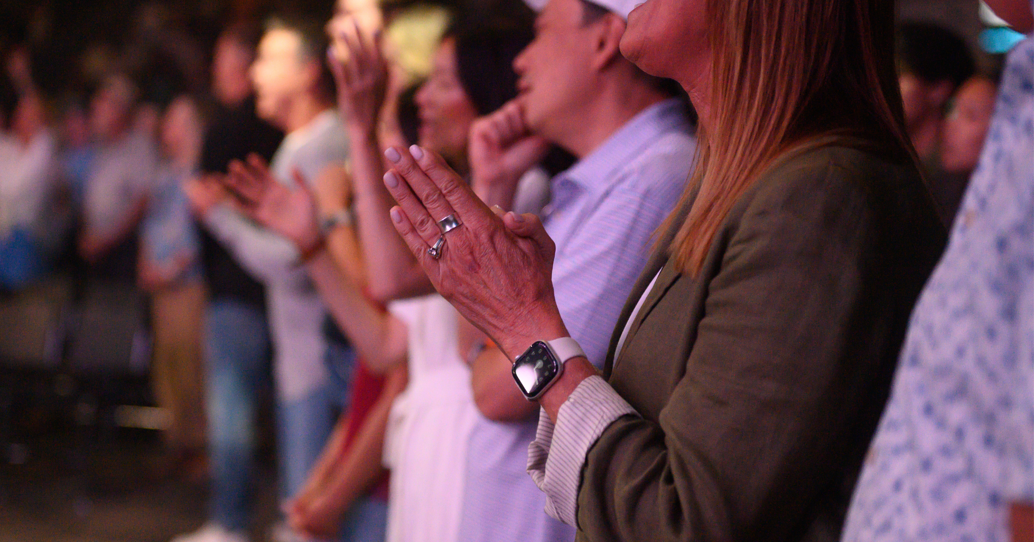 Church congregation worshiping—leaders fostering a teachable posture for discipleship and spiritual growth.