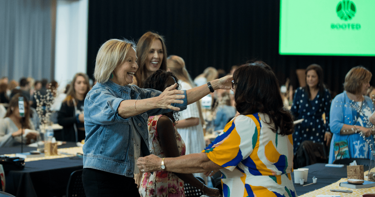 Church members greeting each other warmly, illustrating the biblical community environment where the rhythm of repentance leads to heart transformation and spiritual maturity.